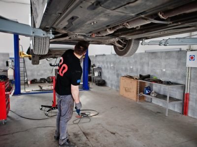 car-repair-maintenance-theme-mechanic-uniform-working-auto-service_627829-3951